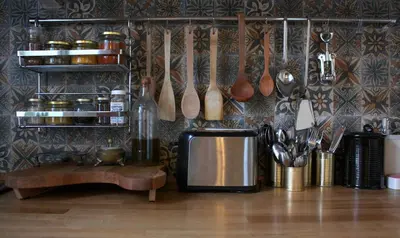 a kitchen with utensils hanging on a wall at Stunning 5 Bedroom Sunlit Apartment Galata in Istanbul