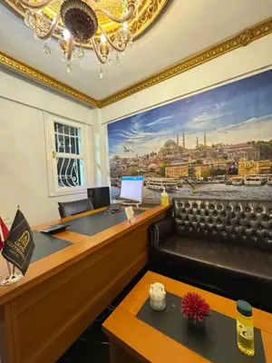 an office with a large painting on the wall at Grand Süleymaniye Hotel in Istanbul