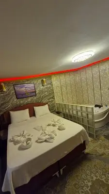 a bedroom with a bed and a bath tub at Gür Star Hotel in Istanbul