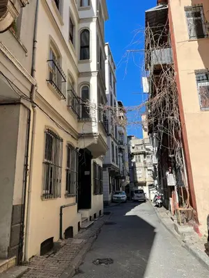 an alley in the city with buildings at Ozcans Pera Flats 8 in Istanbul