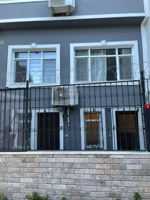 a house with a black fence and windows at Ozcans Pera Flats 10 in Istanbul