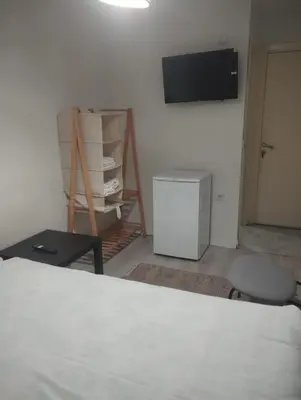 a room with a bed and a tv on a wall at Şişli Suites - Room47 in Istanbul