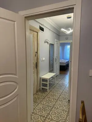 a hallway with a door leading to a room at Ozcans Sururi Pera Flats 2 in Istanbul