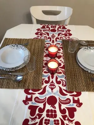 a table with two plates and candles on a table at Ozcans Pera Sururi Flats 4 in Istanbul