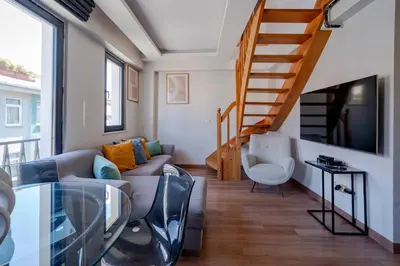 a living room with a couch and a glass table at 3-Bedroom 2-Bathroom Duplex Apartment with Elevator in Istanbul