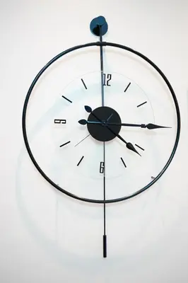 a clock is hanging on a wall at Nine Rooms by taksim in Istanbul