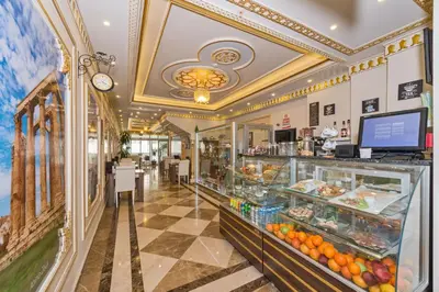 a grocery store with a display case filled with food at Harmony Hotel Merter & SPA in Istanbul