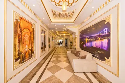 a living room with a couch and paintings on the walls at Harmony Hotel Merter & SPA in Istanbul