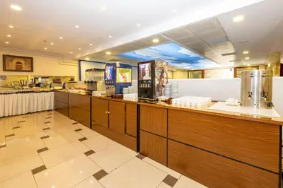 a fast food restaurant with a counter in a cafeteria at Harmony Hotel Merter & SPA in Istanbul