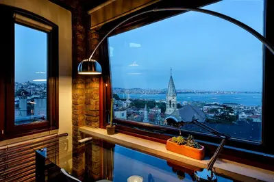 a room with a window with a view of a city at Alaattin Apartments in Istanbul
