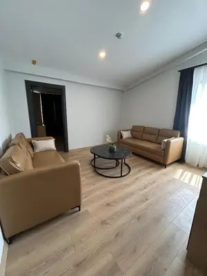 a living room with a couch and a table at Rota Business Hotel Gebze in Güzeltepe