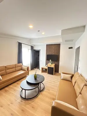 a living room with a couch and a coffee table at Rota Business Hotel Gebze in Güzeltepe