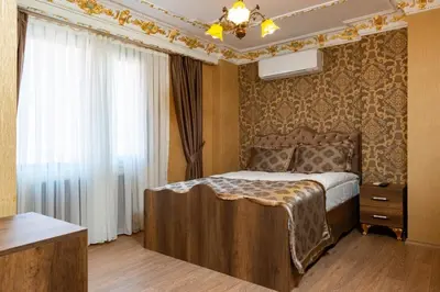 a bedroom with a bed and a window at The Ottoman apartment in Istanbul