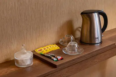 a counter with a coffee pot and glasses on it at The Ottoman apartment in Istanbul