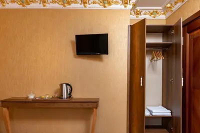 a room with a tv on a wall with at The Ottoman apartment in Istanbul