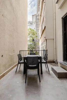 a table and chairs on the balcony of a building at B Polat in Istanbul
