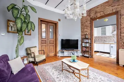 a living room with a couch and a table at Grand Historic 3BD2Bath Galata Tower Pad! #408 in Istanbul