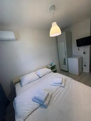 a bedroom with a large white bed with towels on it at Şişli Suites - Room44 in Istanbul