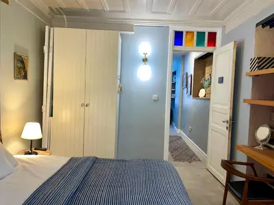 a bedroom with a bed and a hallway at Balat Homes & Apartments Cottage in Istanbul