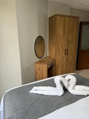 a bedroom with two towels laying on a bed at Rumeli Pansiyon in Kumbağ