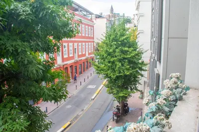 a city street with a tree on the side of a building at Firuzağa Retreat Studio in Beyoğlu in Istanbul
