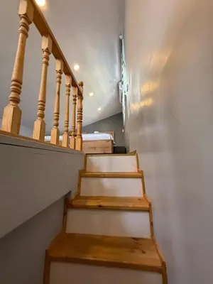 a stairway with wooden steps and a stair case at AYD Apartment Beyoğlu in Istanbul