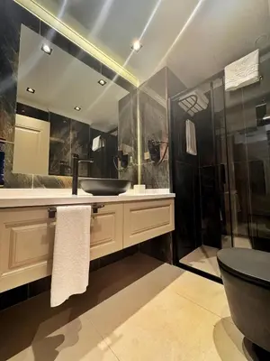 a bathroom with a sink and a shower at Park Dedeman Sisli - Istanbul City Center in Istanbul