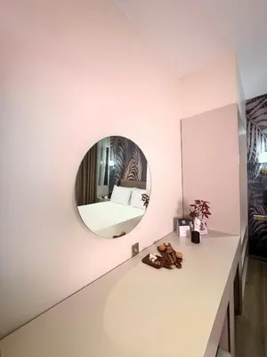 a room with a round mirror on the wall at Park Dedeman Sisli - Istanbul City Center in Istanbul