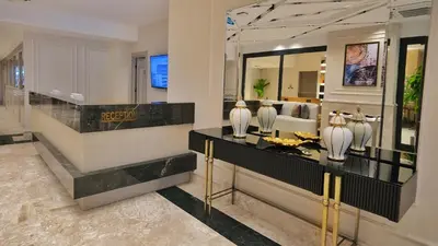 a lobby with vases on a counter with a bed at Park Dedeman Sisli - Istanbul City Center in Istanbul