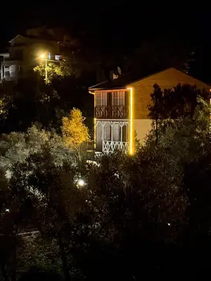 a house with lights on the front of it at night at Doğayla İç içe Lüks Villa in İznik