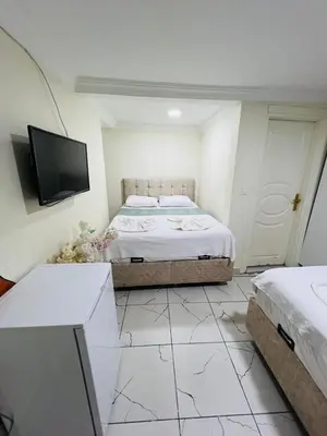 a bedroom with a bed and a flat screen tv at sefa yacht hotel in Istanbul
