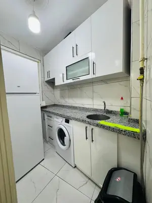 a kitchen with a sink and a washing machine at sefa yacht hotel in Istanbul