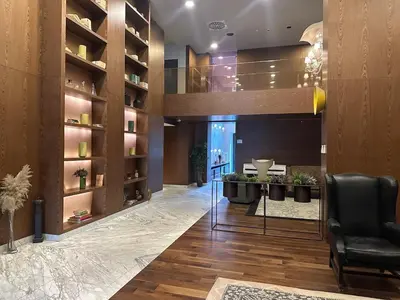 a lobby with a chair and a table in a room at 91 sqm luxury apartment with double view in Istanbul