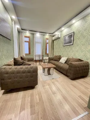 a living room with two couches and a table at Taksim Historic House hotel in Istanbul