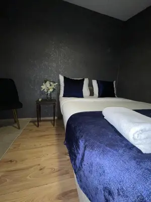 a bedroom with two beds with blue and white pillows at Taksim Historic House hotel in Istanbul