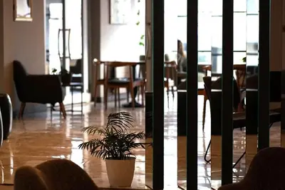 a potted plant sitting in the middle of a room at Altuncu Premium Termal Hotel in Armutlu