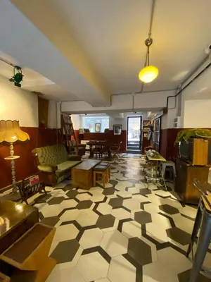 a living room with a checkered floor at Asmaaltı GUEST HOUSE in Bursa