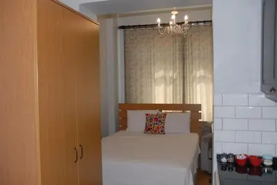 a small bedroom with a bed and a window at Ozcans Pera Flats 4 in Istanbul