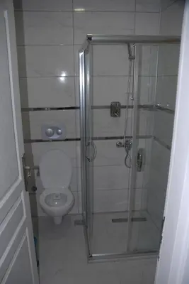 a bathroom with a shower and a toilet at Ozcans Pera Flats 4 in Istanbul