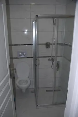 a bathroom with a shower and a toilet at Ozcans Pera Flats 5 in Istanbul