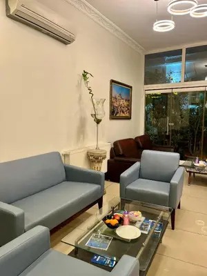a living room with two couches and a coffee table at Adil Konak Hotel in Istanbul