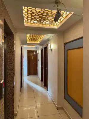a corridor in a building with a ceiling with lights at Adil Konak Hotel in Istanbul