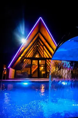 a building with a fountain in front of a house at Zeyno Sapanca in Sapanca