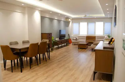 a living room with a couch and a table and chairs at My Glamorous Stay at Kadikoy Istanbul Türkiye in Istanbul
