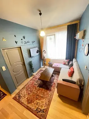 a living room with a couch and a table at Taksim Square home in Istanbul