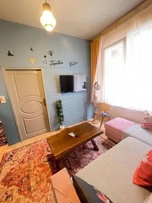 a living room with a couch and a table at Taksim Square home in Istanbul