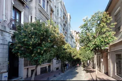 a street in a city with trees and buildings at Historic Elegance with a Bosphorus Gaze in Istanbul