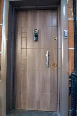a wooden door with a camera on it at Cozy 1BR & Sofabed with Two Inviting Balconies in Beylikduzu
