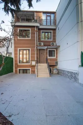 a house with a staircase leading to the front door at Cozy 1BR & Sofabed with Two Inviting Balconies in Beylikduzu