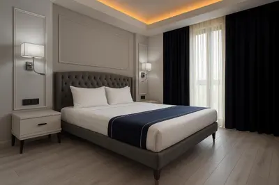 a bedroom with a large bed and a window at Loft Airport Hotel in Arnavutköy
